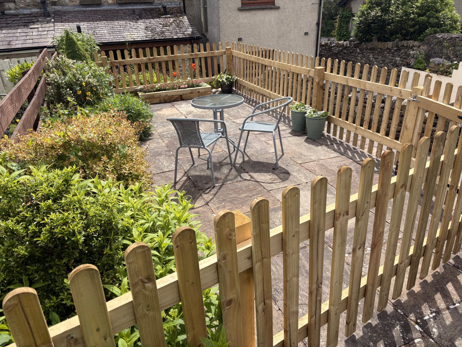 Enclosed cottage garden with stone walls